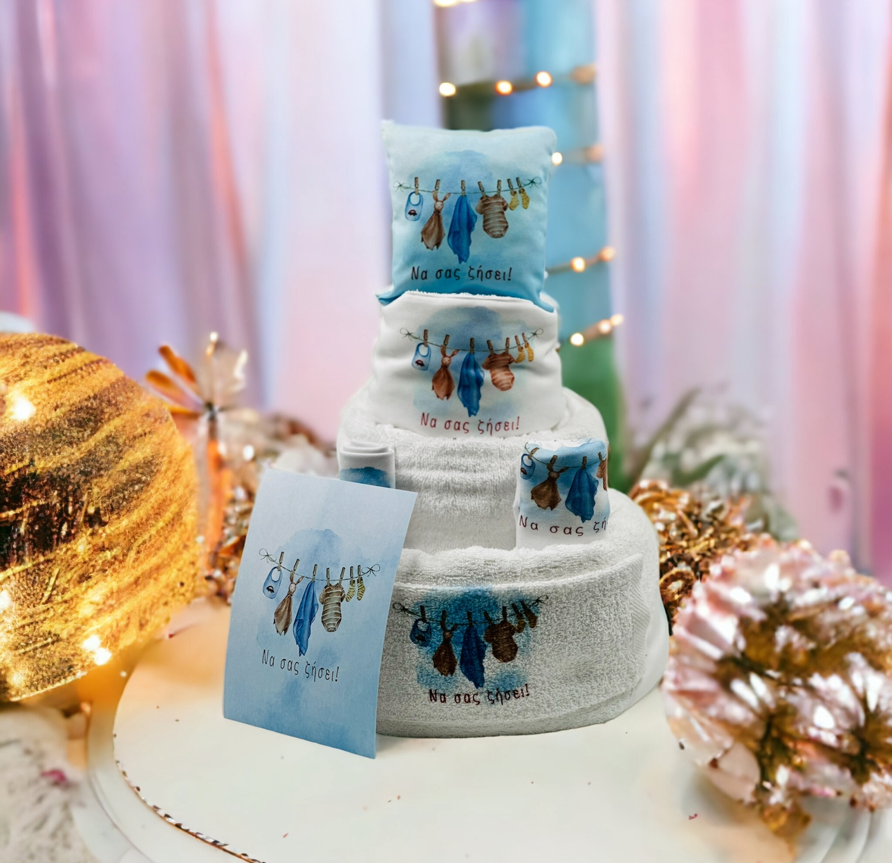 "Να σας ζήσει" Τούρτα από πάνες-λευκά είδη και προίκα.